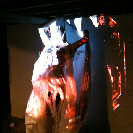 Dancer/Performance Artist, Jamie Lynn Smith testing out her costume with the video projections at a Camera Lucida rehearsal. December, 2012.