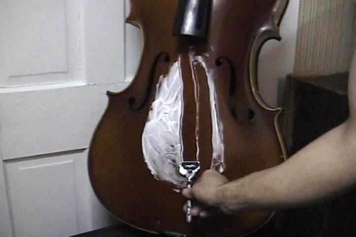 Still from "le violoncelle de Silpayamanant" Experimental video short from 2001. First shown during a live multimedia installation performance by Jon Silpayamanant at the Emerson Art Gallery, DePauw University in 2002.